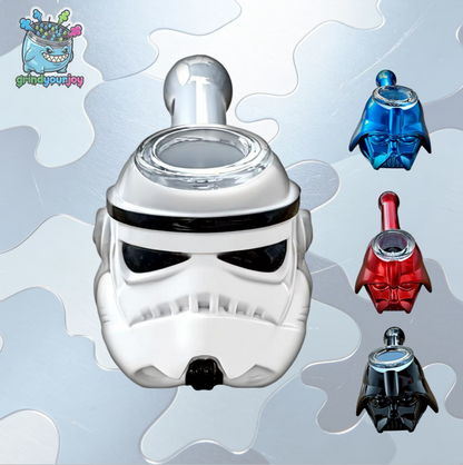 White helmet-shaped bowl-and-mouthpiece accessory with a clear bowl and rear mouthpiece, alongside blue, red, and black versions